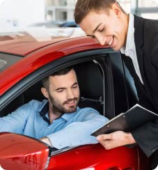 men sitting at the car