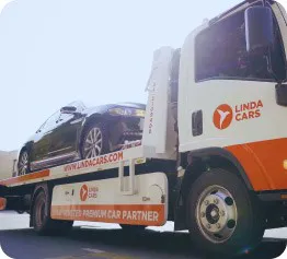 car on top of a towing car